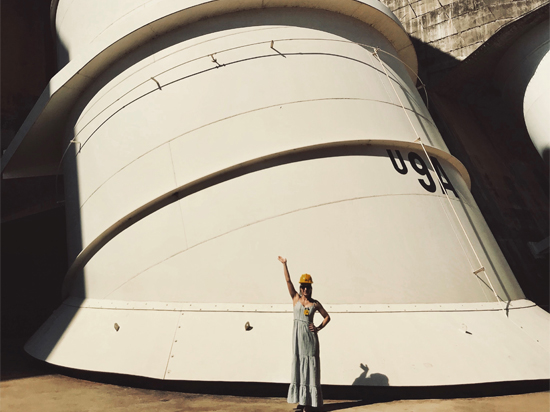 Employee stood in front of the Itaipu Dam