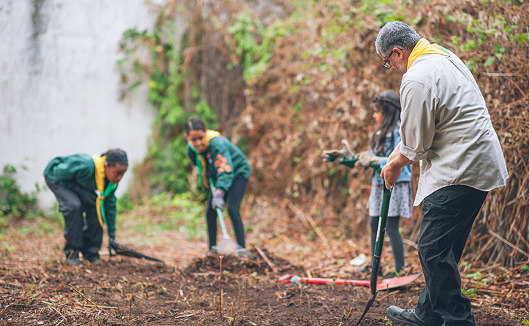 Bristol Muslim Scouts digging outside